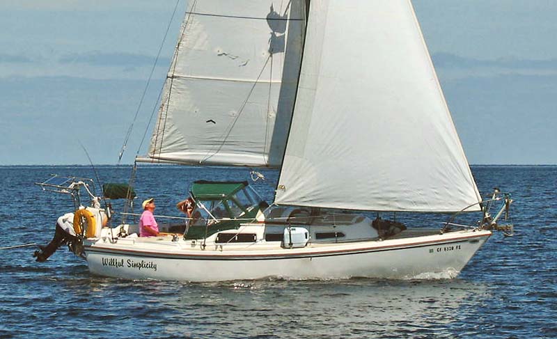 A Catalina 27 is nice at anchor or under sail. © 2022 Willful Simplicity