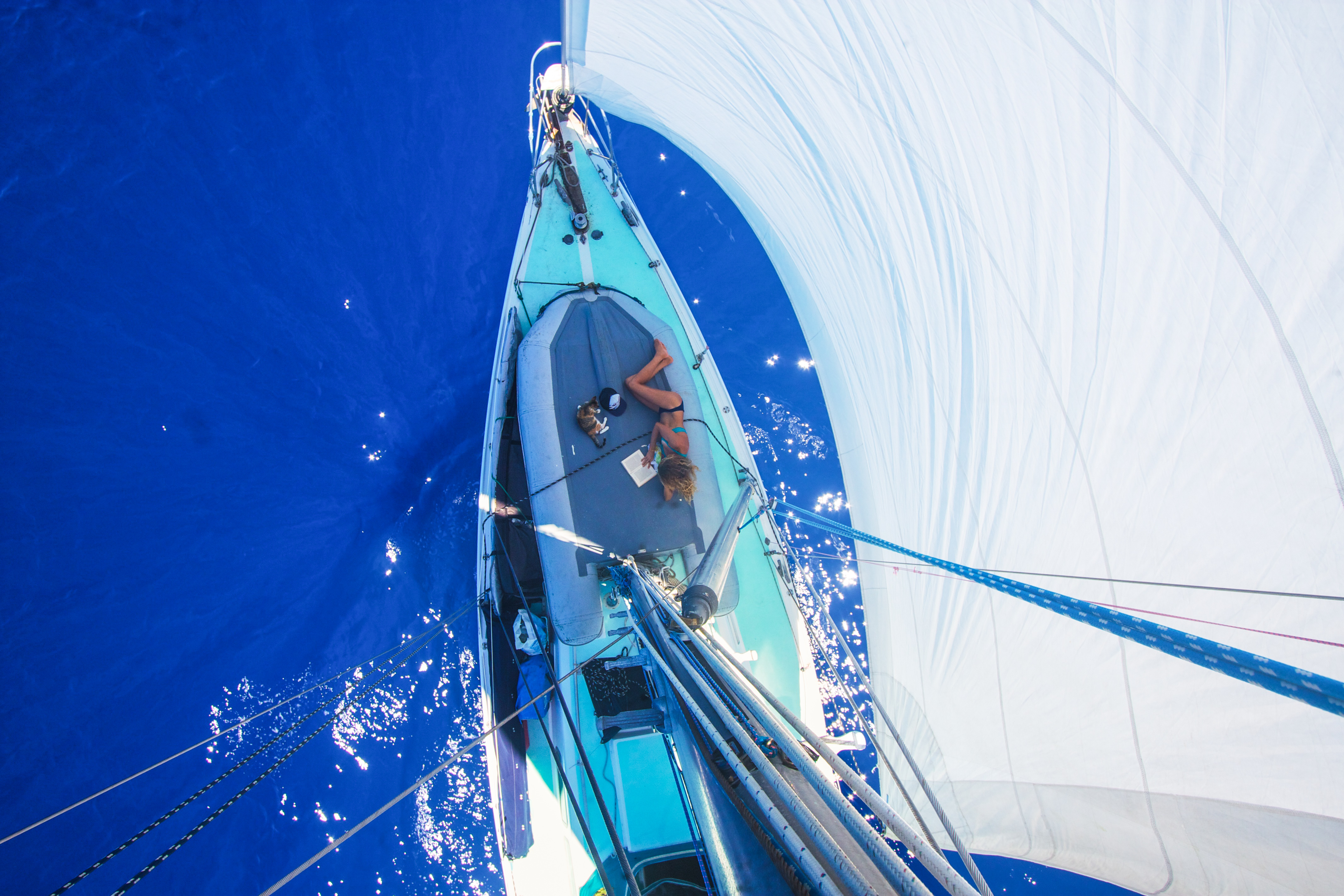 Liz Clark reading fon the foredeck