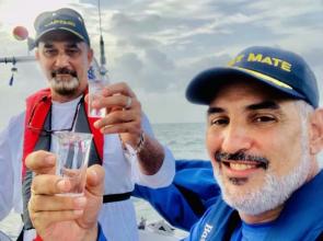 Julio and crew celebrate sailing. 